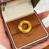 Tienda de oro con simulación de artículos de alta calidad anillo liso de oro colgante de hebilla segura para hombres y mujeres con el mismo giro anillo de transferencia Gankun collar