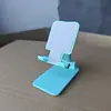 Soporte para teléfono móvil al por mayor, de escritorio multifuncional portátil plegable ajustable actividad regalo juguete venta al por mayor transfronteriza