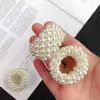 Versão coreana de anel de cabelo de pérola artificial acessórios de cabelo Famoso na internet coque de bola elástico de cabelo para cabelo de menina fofo alta elasticidade corda de cabelo atacado