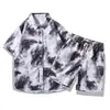 Camiseta de manga corta para hombre con estampado floral estilo tinta, camisa de playa holgada talla grande, conjunto retro de dos piezas estilo Hong Kong al por mayor