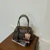 Bolsa de Bowling Negra Super Caliente de Mano para Mujer 2026 Nuevo Estilo de Gama Alta Diseño de Nicho Bolso Cruzado para Viajes de Negocios para Mujer