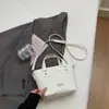 Bolsa de ombro e transversal de patchwork de jeans de alta qualidade para mulheres, nova bolsa de mão para o verão de 2026, bolsa saco, bolsa de ombro e transversal