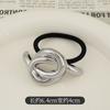 Anillo elástico para el cabello cóncavo-convexo de metal con personalidad de diseño de nicho, cuerda para el cabello de estilo frío que combina con todo, cuerda para la cabeza de temperamento retro europeo y americano.
