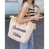 Bolsa Tote de Lona Tecida com Franjas e Letra Bordada Grande Capacidade Bolsa de Ombro Feminina 2026 Novo Estilo Casual para Viagem