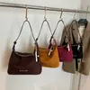 Bolsas Bolsas Femininas Outono e Inverno 2025 Nova Bolsa de Ombro Retro Fosca em PU Bolsa Transversal de Cor Sólida Mais Fácil de Combinar Bolsa de Ombro/Axila