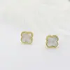 DAYHAO Aretes de trébol elegantes estilo europeo y americano de acero de titanio aretes elegantes de acero inoxidable aretes en stock