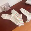 Calcetines de mujer a rayas de lunares coloridos estilo japonés color macarrón longitud media pantorrilla calcetines de mujer ins modernos calcetines casuales de algodón estilo japonés