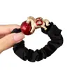 Goma para el pelo con bloques de color negro y rojo, con caballito dorado y símbolos de la suerte para el Año del Caballo, adecuada para coletas altas y accesorios para el cabello