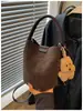 Bolso de gamuza para mujer, nueva moda 2026, bolso cubo retro de nicho, bolso de hombro cruzado de alta gama
