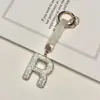 Pingente de chaveiro de carro com 26 letras em inglês cravejado de diamantes transfronteiriço, decoração de bolsa com strass de argila, atacado de chaveiro de celular