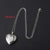 Bestseller transfronterizo acero inoxidable acabado espejo brillante lujo ligero forma de corazón caja de fotos collar que puede contener fotos