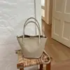 Bolso tejido de patrón único para mujer, nuevo bolso de mano de alta gama vintage otoño 2026, bolso de hombro y bandolera tipo cubo