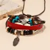 Pulseira de Couro Genuíno com Pingente de Pena de Liga de Metal Novo Estilo Europeu e Americano Mais Vendido para Homens e Mulheres Pulseira Versátil de Couro Bovino com Contas