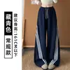 Calça Esportiva Listrada Americana Feminina Outono 2026 Nova Cintura Alta Solta Emagrecedora Estilo Preguiçoso Perna Larga Perna de Banana Calça de Moletom