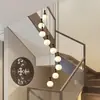 Lámpara de araña larga para escalera de casa autoconstruida, vestíbulo giratorio de planta abierta, sala de estar y comedor de villa, dúplex estilo Zen de vidrio color nogal