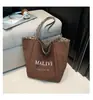 Bolso de Mujer de Alta Gama Estilo Chanel 2026 Modelo Nuevo Acolchado Bordado Bolso de Cadena Bolso Cubo con Cierre de Cordón Bolso de Hombro Único Bolso Cruzado