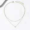Collar de Acero de Titanio Doble Capa con Perlas y Estrella Personalizada Estilo Europeo y Americano, Cadena de Clavícula de Nicho de Gama Alta con un Ambiente Sofisticado para el Viaje Diario