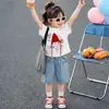 Conjunto de Verano para Niñas Caperucita Roja de Mezclilla Manga Corta 2026 Nueva Moda Conjunto de Dos Piezas con Camiseta Elegante Camiseta de Moda