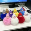 Llavero de bola de muñeca de peluche de imitación de conejo rex transfronterizo, lindo colgante de bolsa de muñeca de peluche para dormir de dibujos animados para niñas