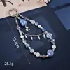 Nuevo colgante de manzana y mariposa con cuentas hecho a mano para teléfono, con un toque de alta gama, charm de cadena doble para bolso, cadena para colgar el teléfono, regalo