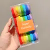 Goma para el pelo elástica al por mayor en caja para niñas coleta alta cuerda para la cabeza goma para el pelo cubierta de cuero nuevo color banda para el pelo cuerda para el pelo