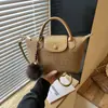 Nova bolsa de ombro trançada simples e estilosa para o dia a dia de outono, bolsa tipo balde da moda, bolsa transversal feminina estilo coreano