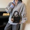 Bolso pequeño casual simple transfronterizo para mujer 2025 Otoño Nueva moda Bolso de mano tipo cubo para viajero Bolso cruzado con textura