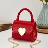 2023 Nuevo bolso mini de gelatina portátil con cierre de corazón en relieve de diamante bolso pequeño casual boca sobre rojo