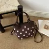 2026 Otoño Temprano Nuevo Exquisito Bolso Cruzado de Lunares para Mujer Bolso de Cubo Vintage de Gamuza de Moda Bolsos para Mujer al por Mayor