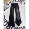 Calça jeans masculina estampada com padrão de raios da moda, design único, calça de nicho estilo hiphop street, calça flare com barra curva estilo americano