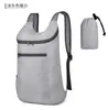 Mochila portátil nova transfronteiriça leve dobrável cor sólida mochila escolar estudantil capacidade grande ao ar livre Mochila Esportiva