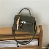 2026 Nueva Moda Trendy Bolso con Hebilla de Cierre Texturizada Estilo Ins Bolso Pequeño Cuadrado para Mujer Primavera y Verano Bolso Cruzado Artístico Elegante