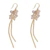 Brincos longos com franjas de contas de bola de diamante, estilo europeu e americano, únicos e modernos, versáteis para mulheres, elegantes e simples com um toque de alta qualidade, ganchos de orelha afinadores