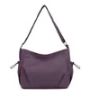 Bolso cruzado de moda ultraligero de gran capacidad 2026 Estilo perezoso multibolsillos bolso de hombro impermeable de nailon bolso para la axila