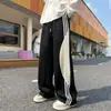 Pantalones de chándal con cordón a rayas de bloques de color de verano de marca de moda otoñal para hombre, estilo callejero vintage, pantalones casuales holgados y versátiles