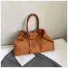 Bolsa Casual Retro de Grande Capacidade 2025 Nova Versátil para o Dia a Dia Feminina Bolsa de Ombro Bolsa Tote de Mão em Camurça