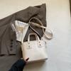 Bolso de mano de textura de alta gama de nueva moda 2025 para mujer, bolso de hombro tipo cubo con bandolera, bolso popular de comercio exterior de este año