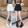 Falda negra versátil de primavera y verano para mujer, con abertura, nueva moda 2026, de cintura alta, adelgazante, línea A, corta