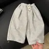 Ropa infantil coreana 2026 primavera y otoño pantalones casuales de pierna ancha para niñas pantalones deportivos holgados para bebé niños moda