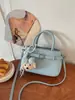 Moda de Verano Transfronteriza 2026 Tendencia Casual Popular Bolso de Mano para Mujer, Bolso de Hombro, Bolso Cruzado Tipo Cubo