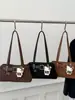 Outono Novo 2025 Moda Retrô Casual Design de Nicho Bolsa de Axila Textura Casual Feminina Bolsa de Ombro Personalizada