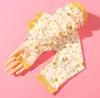 Moda Flor Mujer Nuevo Melocotón Protector Solar Manga de Seda Helada Holgada Estilo Coreano Versátil Conducción Montar al Aire Libre Protector de Brazo