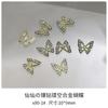 Brocas para uñas con forma de mariposa hueca de aleación con explosiones transfronterizas, venta al por mayor, con diamantes tridimensionales, adornos para uñas de metal dorado y plateado.