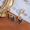 Pendientes de Diamante Negros Personalizados de Moda Cobre Chapado en Oro Real Lujo Ligero Moda Alto Sentido Elegante Elegante Hebilla de Oreja Pendientes Viento Frío