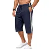 Pantalones cortos de playa de punto elástico transpirables de tres rayas para hombre, de verano, europeos y americanos, sueltos, de deporte, recortados para hombre