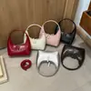 2026 Novo Modelo Bolsa de Ombro Meia-Lua, Bolsa de Mão de Couro Envernizado Colorido, Bolsa de Mão com Design de Nicho Fashion, Bolsa Pequena Tendência