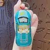 Chaveiro Pingente Criativo de Carro Esportivo de Liga Brinquedo Desenho Animado Casal Carro de Puxar Pingente para Mochila Escolar Pequeno Presente