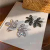 Pendientes de flor europeos y americanos transfronterizos con incrustaciones de diamantes, pendientes de personalidad de moda de alta gama de nicho, pendientes simples elegantes de lujo ligero para mujer