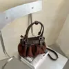 Exquisita Súper Popular Bolso de Pliegues de Nicho para Mujer 2026 Nuevo Estilo Bolso Cruzado de Moda Retro Cubo de Gamuza y Peluche