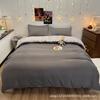 Oferta especial estilo luxo leve transmissão ao vivo conjunto de quatro peças cor sólida sono nu nórdico simples escovado amigo da pele fábrica de Nantong roupa de cama